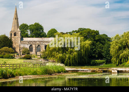 Taken across Brompton Ponds, All Saints Church in Brompton by Sawdon near Scarborough, North Yorkshire, England. 03 June 2007. Stock Photo