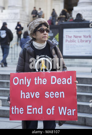 On the 15th Anniversary of the American war in Iraq peace activists critical of America's aggressive military actions around the world came to speak out against all US military aggression. New York City. Stock Photo