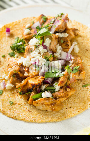 Homemade Chicken Tacos with Onion Cilantro and Cheese Stock Photo