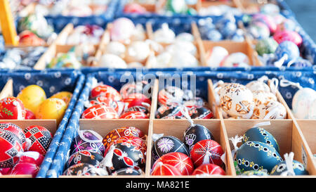 Wide selection of Easter eggs, traditional souvenirs in the kiosk of street market during celebration of Easter in Central  Europe. Stock Photo