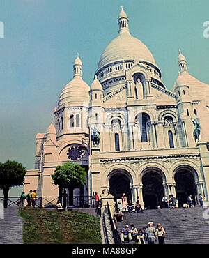 PARIS, FRANCE - CIRCA 1960: Basilica of Sacre Coeur de Paris, Sacred Heart church of Paris in France. Historic Montmartre district buildings. Archival France on 60s. Stock Photo