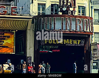 PARIS, FRANCE - CIRCA 1960: Basilica of Sacre Coeur de Paris, Sacred Heart church of Paris in France. Historic Montmartre district buildings and famous Moulin Rouge theater. Archival France on 60s. Stock Photo