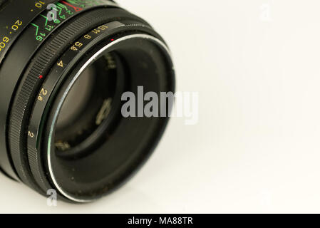 Detailed shot of an old vintage camera lens isolated on a white background Stock Photo