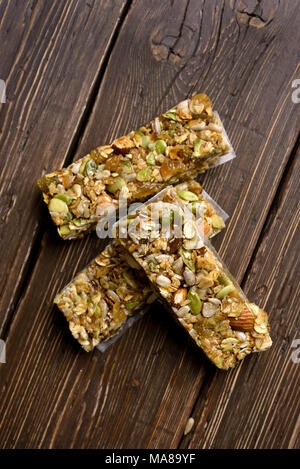 Healthy energy snack granola on wooden background. Top view, flat lay Stock Photo