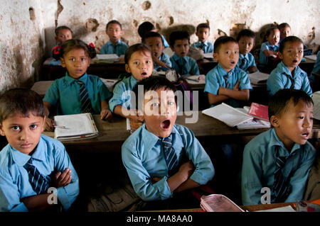 Nepal 2014. Khandbari. 'Boarding' primary school (ie private) . Pupils in classroom answering teacher. Stock Photo