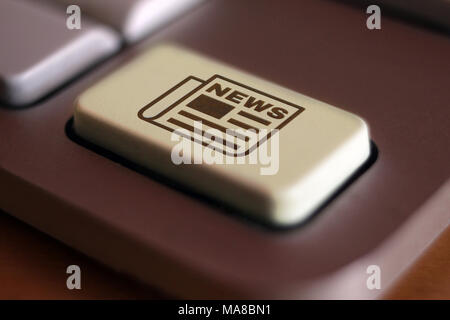 Image of newspaper icon on computer keyboard Stock Photo