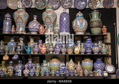 Morocco, Fes, Quartier des Potiers, Pottery showroom, colourfully decorated pots shop display Stock Photo