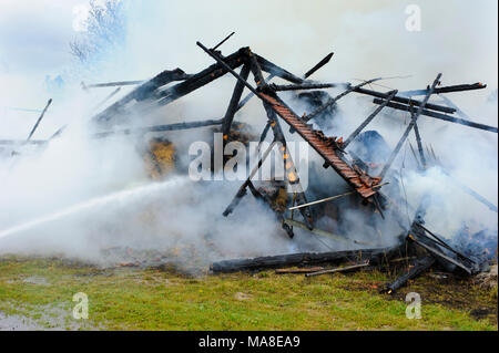 fire brigade in action at burning farm house in Bavaria, Germany, Stock Photo