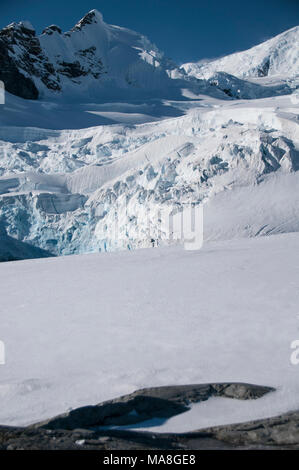 Snow covered mountains at Paradise Bay, Antarctica Stock Photo