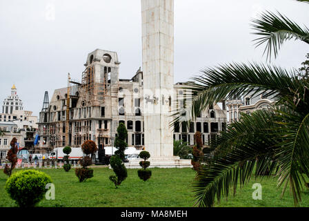 Close up on the column of the Medea statue and the building under construction behind the column at the Europe Square in Batumi, Adjara, Georgia. Stock Photo