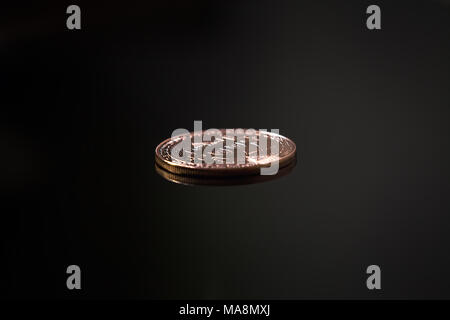 Golden Bitcoin on Black Background, Rotation Close-up Stock Photo