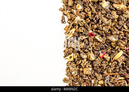 tea leaves, with rose and mango on white background Stock Photo