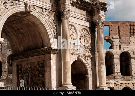Ornate facade of the Arch of Constantine, Arco di Costantino, and the Colosseum Rome Stock Photo