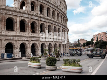 A security perimeter of concrete planters and armoured vehicles around The Colosseum, Rome Stock Photo