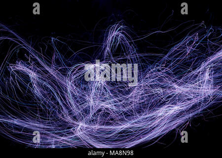 Multi color abstract light painting. LED lights on black background Stock Photo