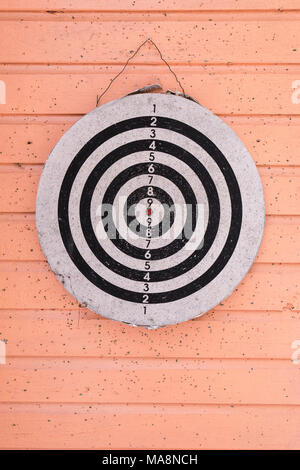 Old darts game on wooden wall Stock Photo