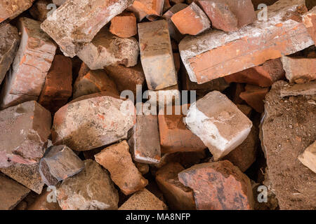 Brick background pattern. Pile of red stones. Stock Photo