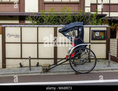 Kyoto, Japan - Nov 29, 2016. A rickshaw on street at old town in Kyoto Japan. Kyoto was the capital of Japan for over a millennium. Stock Photo