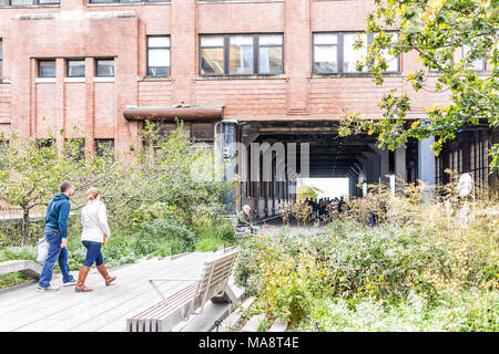 New York City, USA - October 30, 2017: Highline, high line boardwalk, walk, urban garden in New York City NYC with many people tourists walking in Che Stock Photo