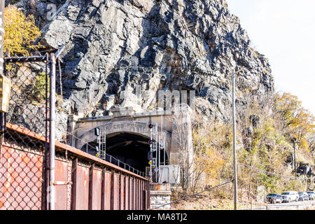 Harper's Ferry, USA - November 11, 2017: Empty railroad sign bridge tunnel entrance in fall autumn by small village town in West Virginia, WV Stock Photo