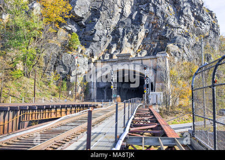 Harper's Ferry, USA - November 11, 2017: Empty railroad sign bridge tunnel entrance in fall autumn by small village town in West Virginia, WV Stock Photo