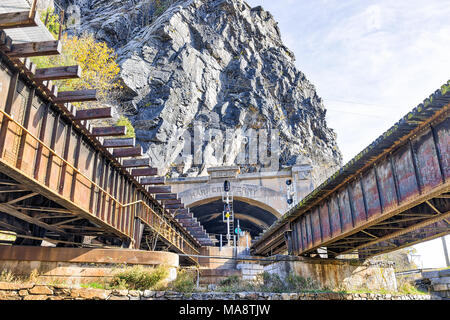 Harper's Ferry, USA - November 11, 2017: Empty railroad sign bridge tunnel entrance in fall autumn by small village town in West Virginia, WV Stock Photo