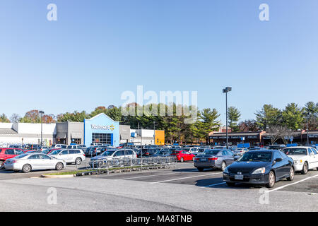 Burke, USA - November 24, 2017: Walmart plaza shopping center sign in Virginia with parking lot, stores shops Stock Photo