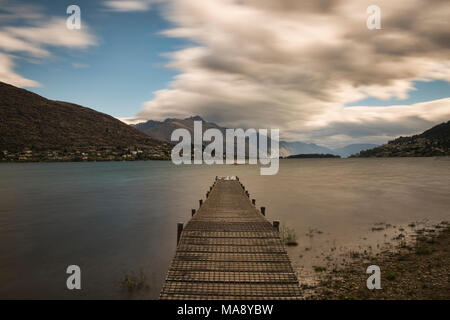 Antarctic winds and clouds sailing over Lake Wakatipu near Queenstown, New Zealand Stock Photo