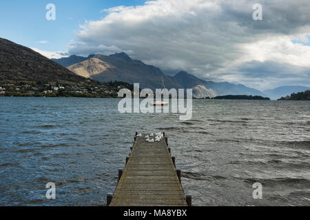 Antarctic winds and clouds sailing over Lake Wakatipu near Queenstown, New Zealand Stock Photo