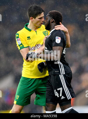 Norwich City's Timm Klose (left) and Fulham's Aboubakar Kamara clash during the Sky Bet Championship match at Carrow Road, Norwich. Stock Photo