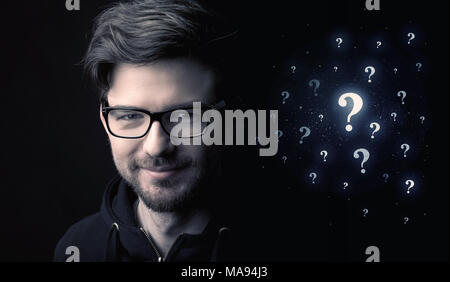 businessman with many question mark near him Stock Photo