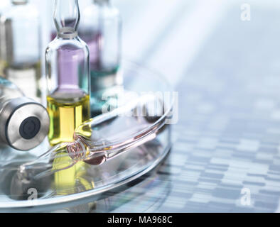 Personalised medicine, conceptual image. Variety of drugs sitting on a DNA (deoxyribonucleic acid) autoradiogram. Stock Photo