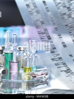 Personalised medicine, conceptual image. Variety of drugs sitting on a DNA (deoxyribonucleic acid) autoradiogram. Stock Photo