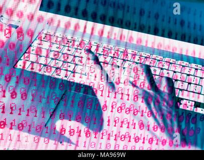 MODEL RELEASED. Cyber attack, conceptual image. Hacker accessing somebody else's computer programme. Stock Photo