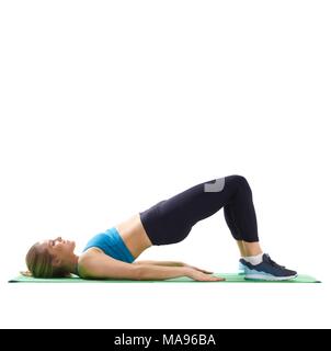 Young woman doing bridge, side view. Stock Photo