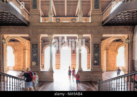 Visitors inside Plaza de España, Seville, Spain Stock Photo