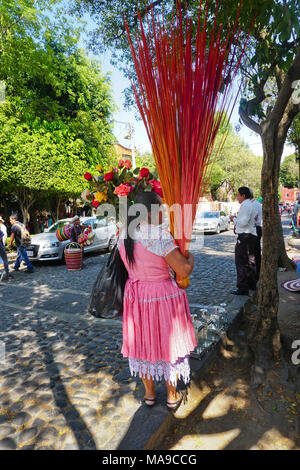 Indigenous woman selling flowers in the Plaza San Jacinto in San Angel neighborhood of Mexico City, Mexico Stock Photo