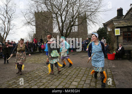 Heptonstall, UK. 30th March, 2018. Female Morris Dancers in Weavers Square on Good Friday in the historical village of Heptonstall, 30th March, 2018 (C)Barbara Cook/Alamy Live News Stock Photo