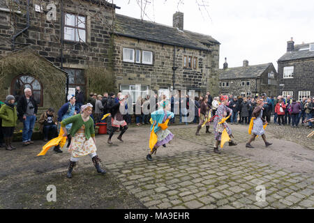 Heptonstall, UK. 30th March, 2018. Prior to the PACE EGG Play a  'Traditional ' Yorkshire dance of the Washerwomen ! A traditional Pace Egg play is performed in Heptonstall’s Weavers Square on Good Fridays, attracting hundreds of visitors to the village. Credit: Steve Morgan/Alamy Live News Stock Photo