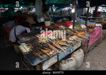 Krong Kaeb, Kep Province, Cambodia, 30 March 2018. Woman selling grilled skewers at the Crab Market Stock Photo