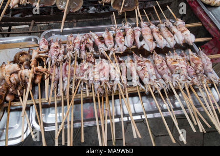 Krong Kaeb, Kep Province, Cambodia, 31 March 2018. Octopus skewers on a grill ready to eat Credit: David GABIS/Alamy Live News Stock Photo
