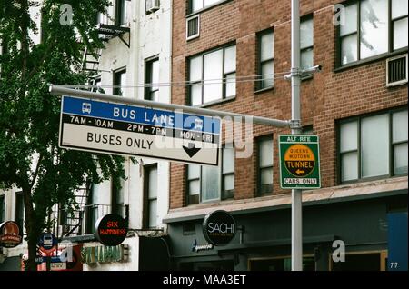 Road sign indicating a designated lane for buses and public transit vehicles, approaching the Queens Midtown Tunnel, in Manhattan, New York City, New York, September 15, 2017. () Stock Photo