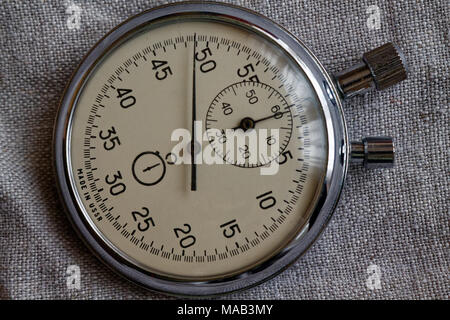 Stopwatch, on canvas background, value measure time, old clock arrow minute and second accuracy timer record Stock Photo