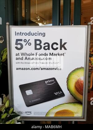 Sign at Whole Foods market grocery store in San Ramon, California announcing promotion in which Amazon Prime credit card holders receive a 5% discount when shopping at the store, February 27, 2018. On August 28, 2017, Amazon completed its acquisition of the upscale grocery chain. () Stock Photo