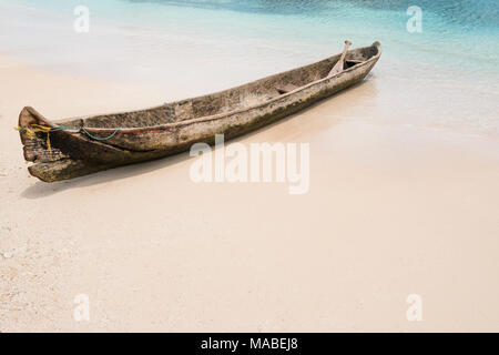 wooden boat on beach, traditional canoe boat isolated on beach - Stock Photo