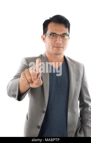 Portrait of businessman touching an imaginary screen against white background Stock Photo