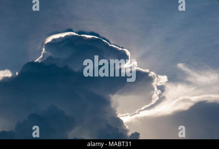 Amazing photo of sun shining through the clouds Stock Photo