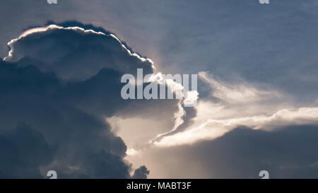 Amazing photo of sun shining through the clouds Stock Photo