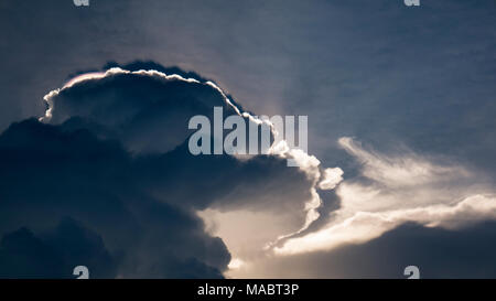 Amazing photo of sun shining through the clouds Stock Photo