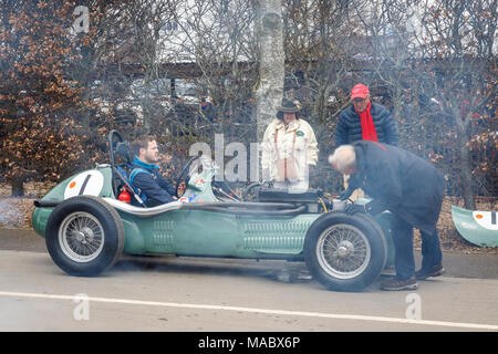 A smoking 1959 HWM-Alta 51 with driver Jarrah Venebles, Hawthorne Trophy entrant, in the paddock at Goodwood 76th Members Meeting, Sussex, UK. Stock Photo